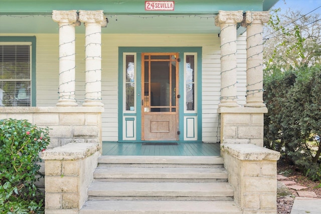 entrance to property featuring covered porch