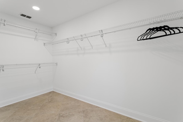 walk in closet with visible vents