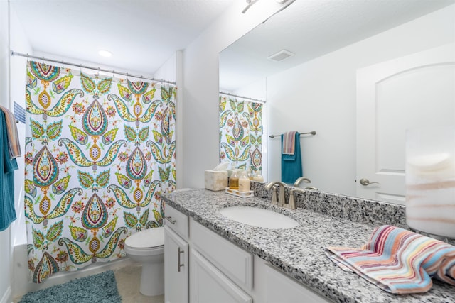 full bathroom featuring vanity, tile patterned flooring, toilet, visible vents, and shower / bath combo with shower curtain