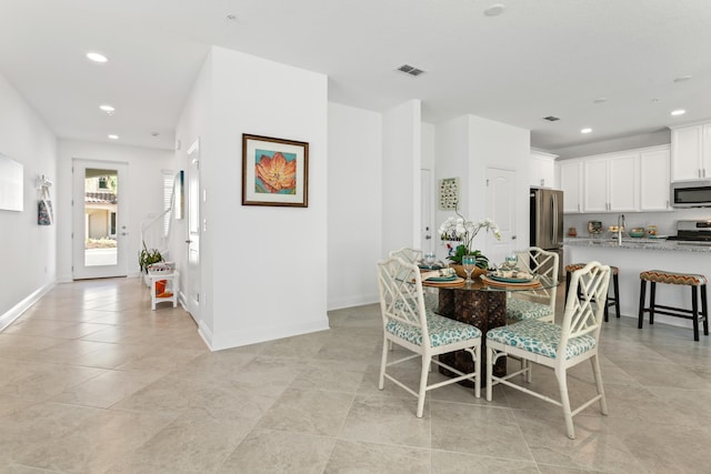 dining space featuring visible vents, baseboards, recessed lighting, and light tile patterned floors