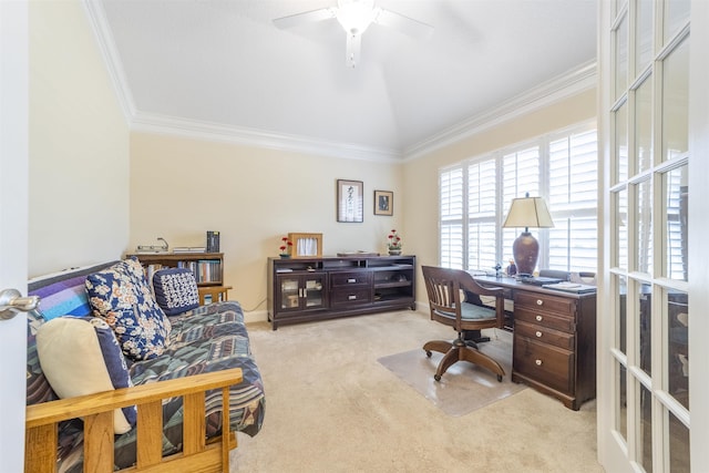 carpeted office featuring lofted ceiling, baseboards, ornamental molding, and a ceiling fan