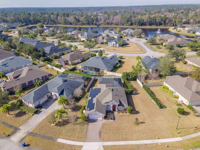 birds eye view of property featuring a water view and a residential view