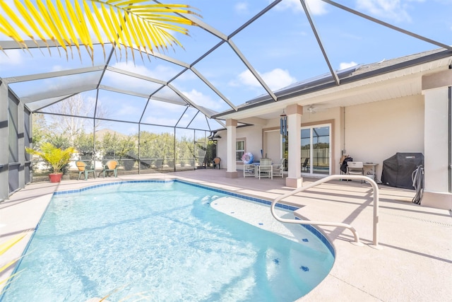 pool featuring a patio area, a grill, and a lanai