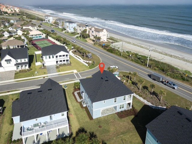 bird's eye view featuring a residential view, a beach view, and a water view