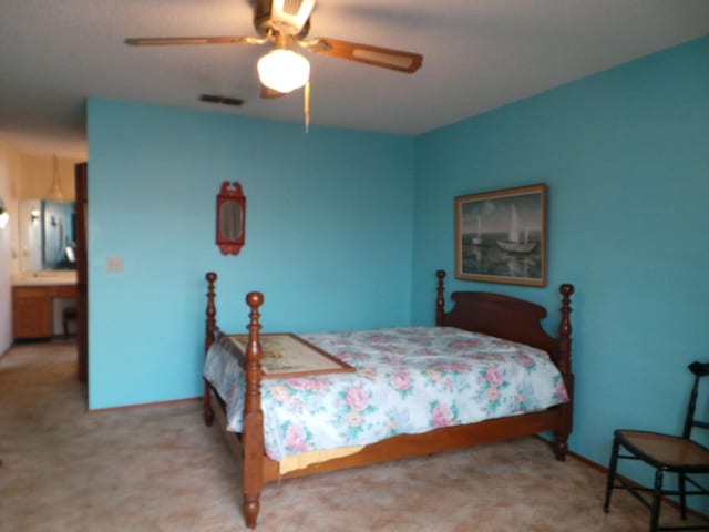 carpeted bedroom featuring ceiling fan