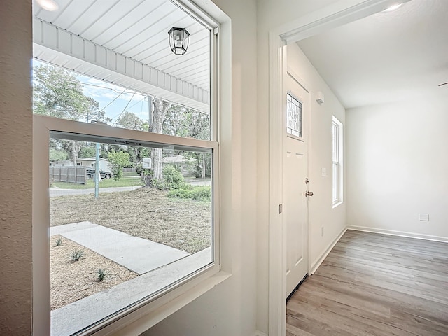 921 Helen St, Saint Augustine, FL 32084 - doorway to outside featuring healthy amount of natural light, wood finished floors, and baseboards