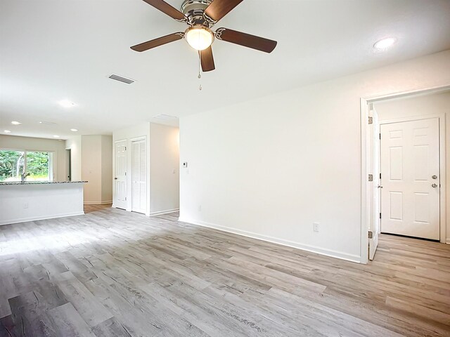 921 Helen St, Saint Augustine, FL 32084 - unfurnished living room with a ceiling fan, light wood-type flooring, baseboards, and recessed lighting