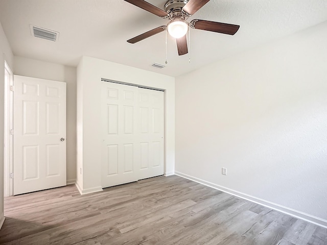 921 Helen St, Saint Augustine, FL 32084 - unfurnished bedroom featuring light wood-style flooring, baseboards, a closet, and ceiling fan