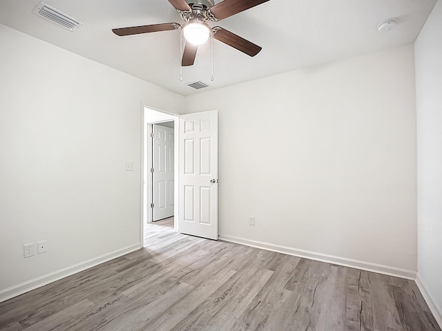 921 Helen St, Saint Augustine, FL 32084 - unfurnished bedroom featuring wood finished floors, baseboards, and a ceiling fan