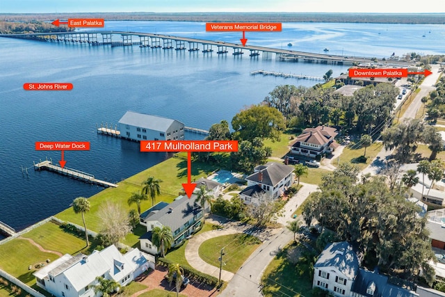 birds eye view of property with a water view