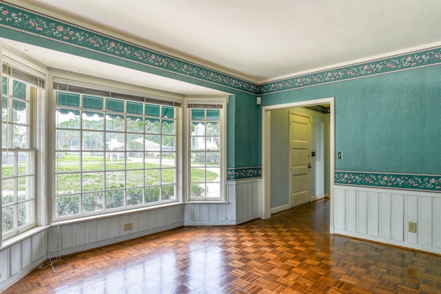 spare room with dark parquet floors