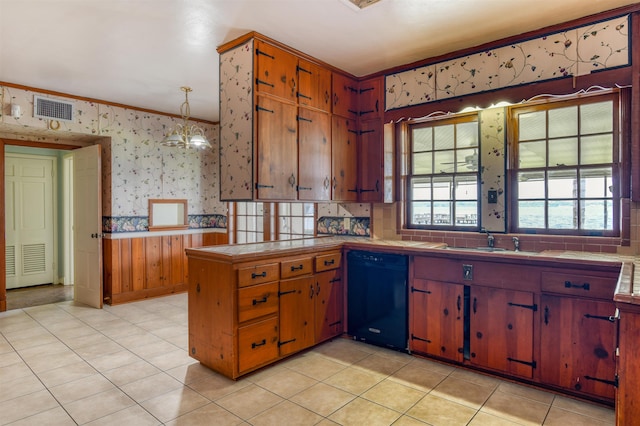 kitchen featuring sink, crown molding, black dishwasher, decorative light fixtures, and kitchen peninsula