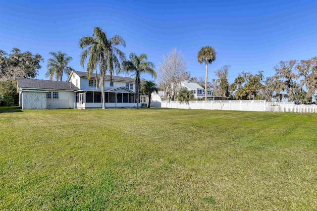 view of yard featuring a sunroom