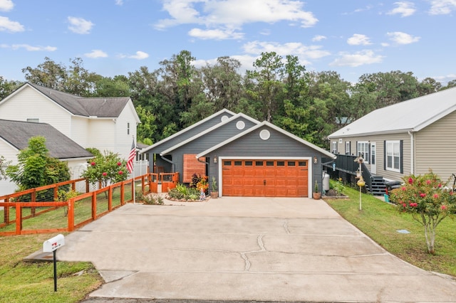 view of front facade with a garage and a front yard