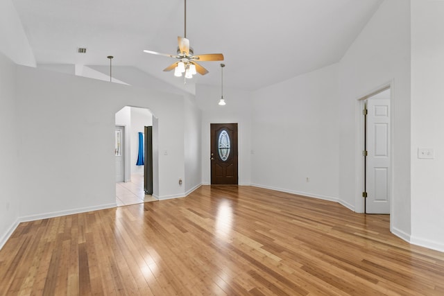 entrance foyer featuring ceiling fan, light hardwood / wood-style floors, and vaulted ceiling