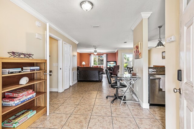 tiled home office with a textured ceiling, ceiling fan, and crown molding