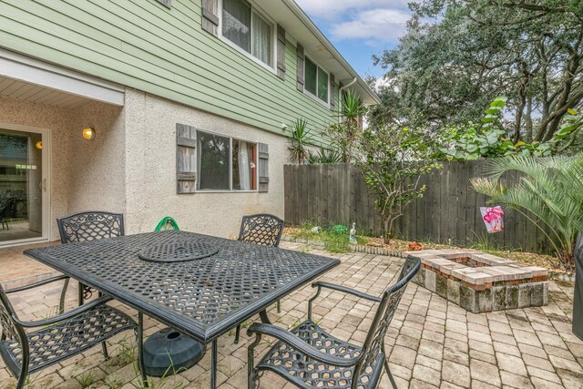 view of patio / terrace featuring a fire pit