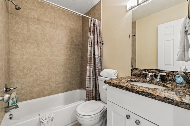 full bathroom with vanity, a textured ceiling, toilet, and shower / bath combo with shower curtain