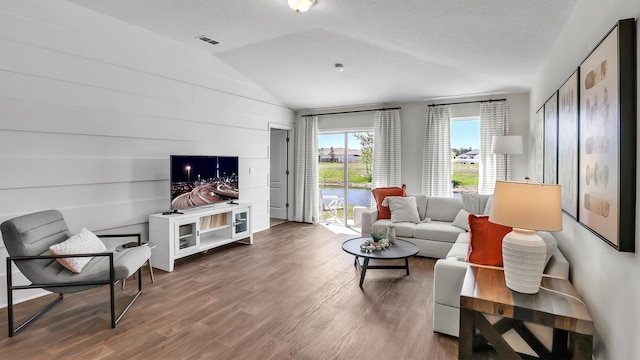 798 Grand Reserve Dr, Bunnell, FL 32110 - living room with wood finished floors and vaulted ceiling