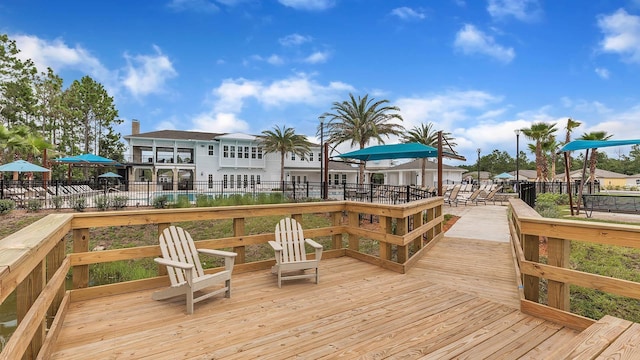 798 Grand Reserve Dr, Bunnell, FL 32110 - dock featuring a wooden deck and fence
