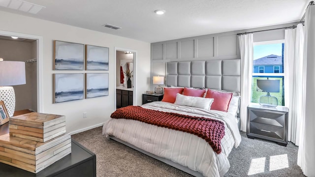 798 Grand Reserve Dr, Bunnell, FL 32110 - bedroom with carpet floors, recessed lighting, baseboards, and ensuite bath
