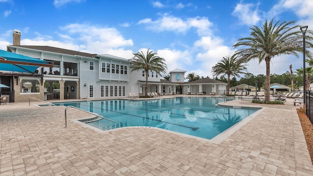798 Grand Reserve Dr, Bunnell, FL 32110 - community pool with a patio and fence