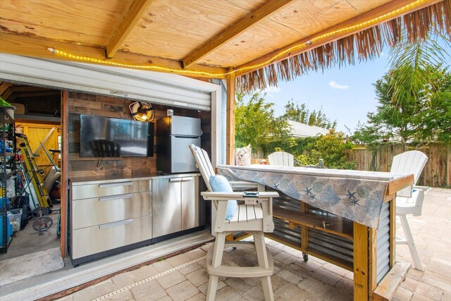 75 Osceola St, Saint Augustine, FL 32084 - view of patio featuring outdoor dry bar and fence