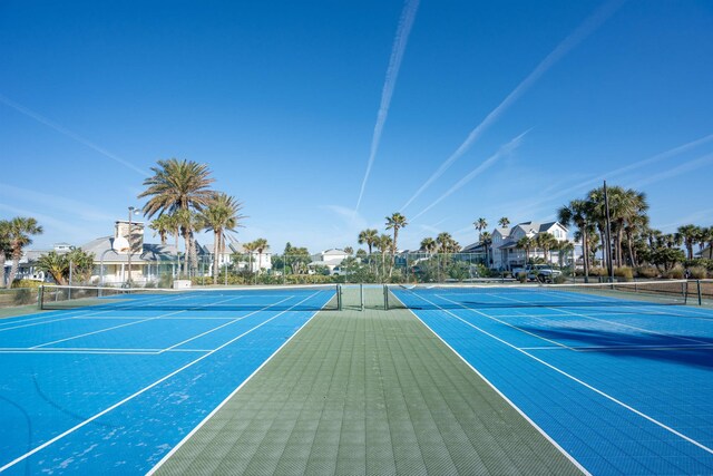 view of tennis court with fence