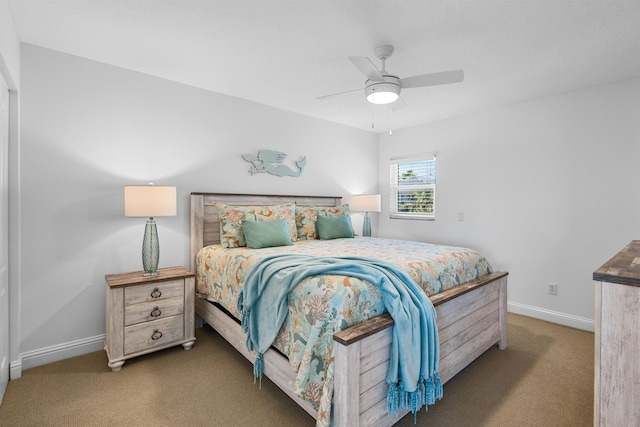 carpeted bedroom featuring ceiling fan and baseboards