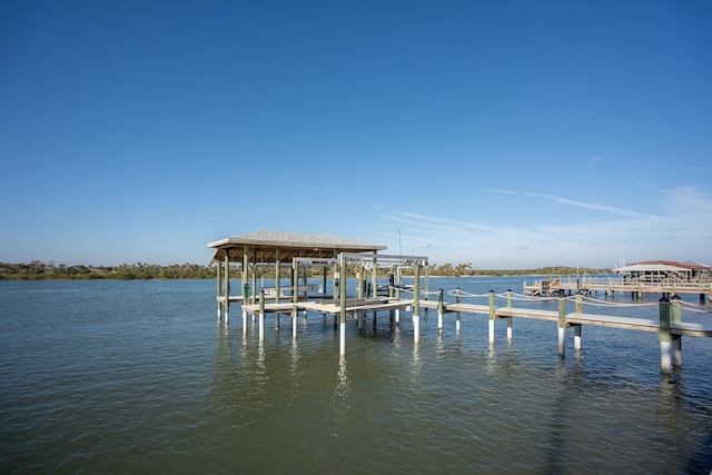 view of dock with a water view and boat lift