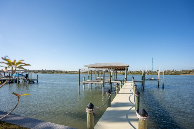 view of dock featuring a water view and boat lift