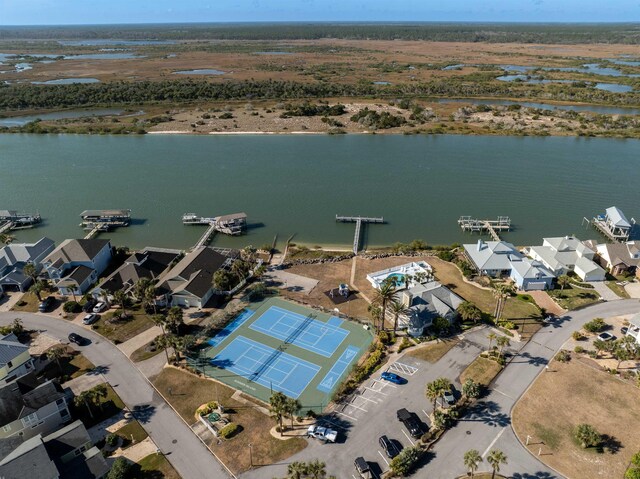 birds eye view of property featuring a water view and a residential view