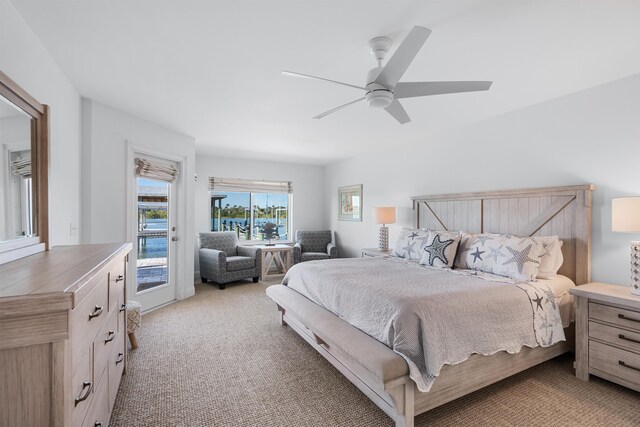 bedroom with a ceiling fan, access to outside, and light colored carpet