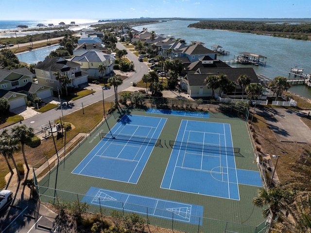 drone / aerial view featuring a water view and a residential view