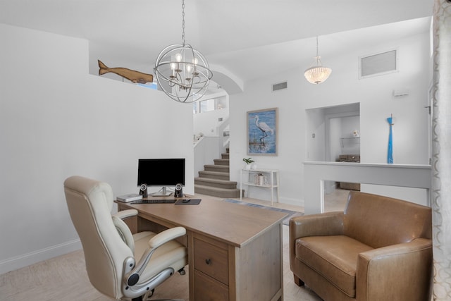 office space with a chandelier, visible vents, and baseboards