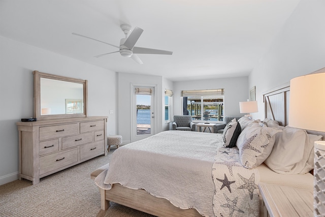 carpeted bedroom featuring a ceiling fan, access to outside, and baseboards