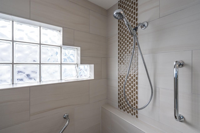 full bath featuring a tile shower