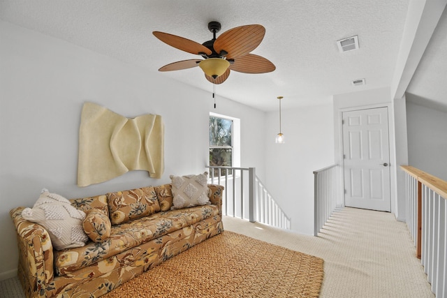 2749 S Ponte Vedra Blvd, Ponte Vedra Beach, FL 32082 - carpeted living area featuring a ceiling fan and a textured ceiling