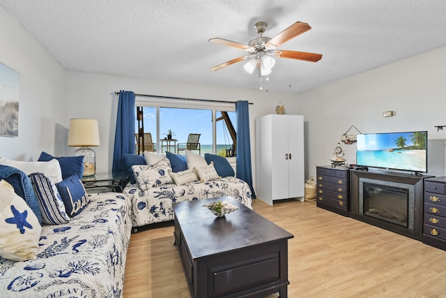 2749 S Ponte Vedra Blvd, Ponte Vedra Beach, FL 32082 - living area featuring light wood-style floors, a textured ceiling, and a ceiling fan