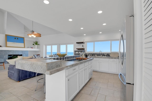 2749 S Ponte Vedra Blvd, Ponte Vedra Beach, FL 32082 - kitchen featuring plenty of natural light, freestanding refrigerator, recessed lighting, white cabinetry, and a center island