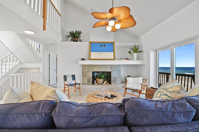 2749 S Ponte Vedra Blvd, Ponte Vedra Beach, FL 32082 - living area featuring high vaulted ceiling, a water view, stairs, a ceiling fan, and a tile fireplace