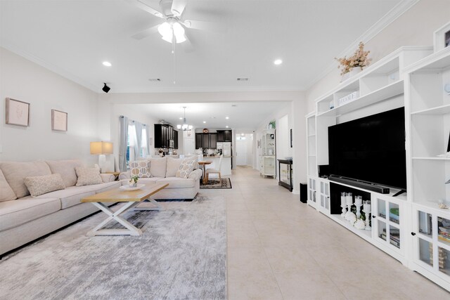 living room with built in features, crown molding, light tile patterned floors, recessed lighting, and ceiling fan with notable chandelier