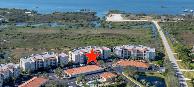 birds eye view of property featuring a water view