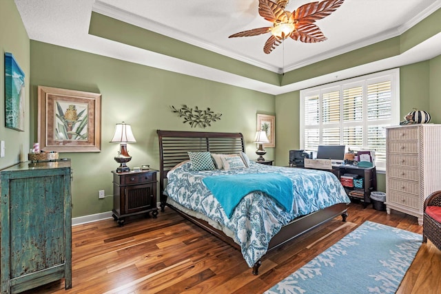 bedroom with ceiling fan, dark hardwood / wood-style flooring, and crown molding