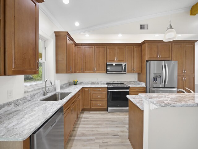 kitchen with sink, crown molding, appliances with stainless steel finishes, pendant lighting, and light stone countertops