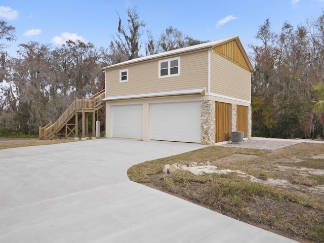 view of side of home with a garage