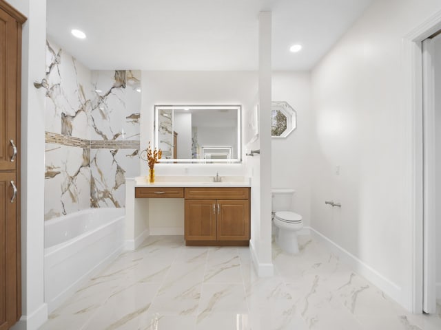 bathroom featuring a tub to relax in, toilet, and vanity