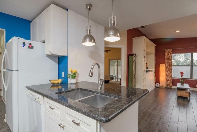 kitchen with a sink, dark wood finished floors, white cabinetry, dark stone counters, and white dishwasher