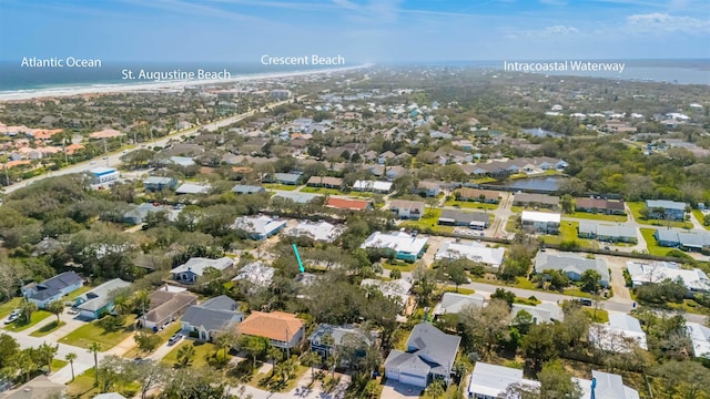 bird's eye view with a residential view and a water view