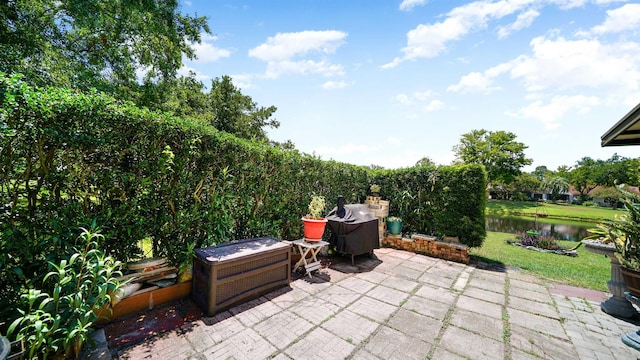 view of patio / terrace featuring a water view